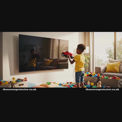 Child playing safely near a protected television